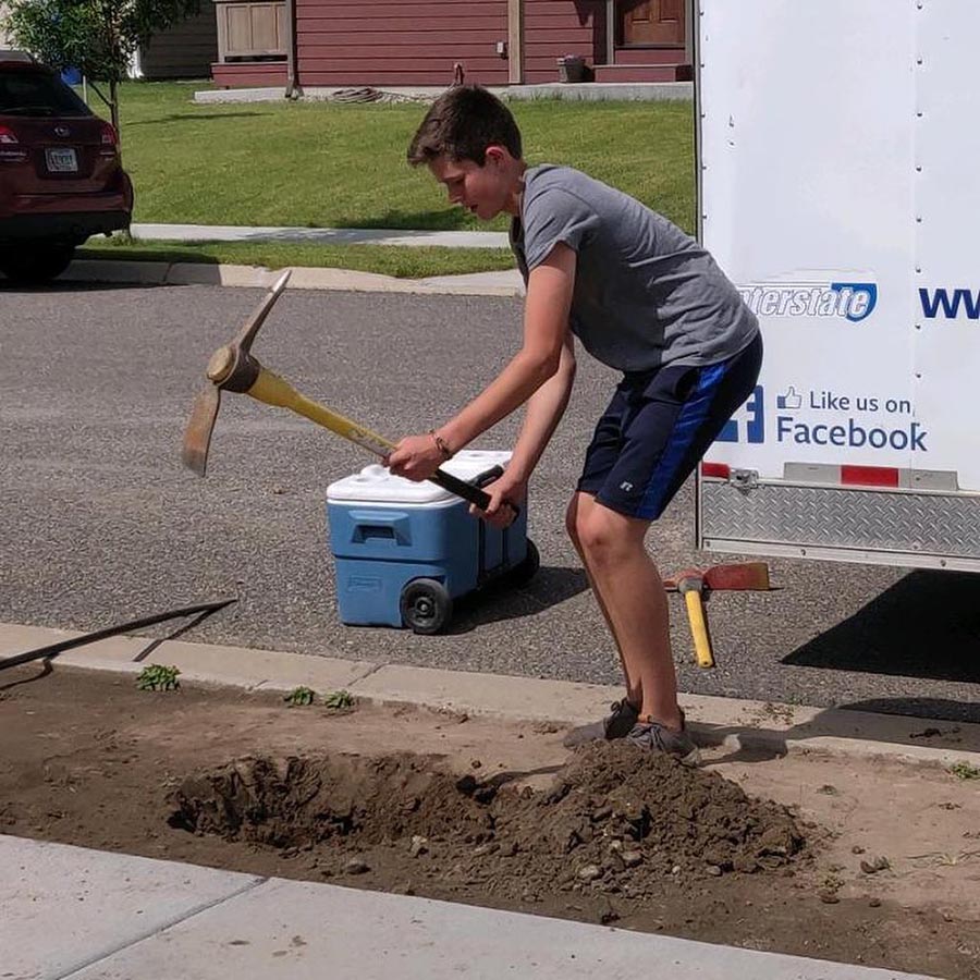 young man digging hole